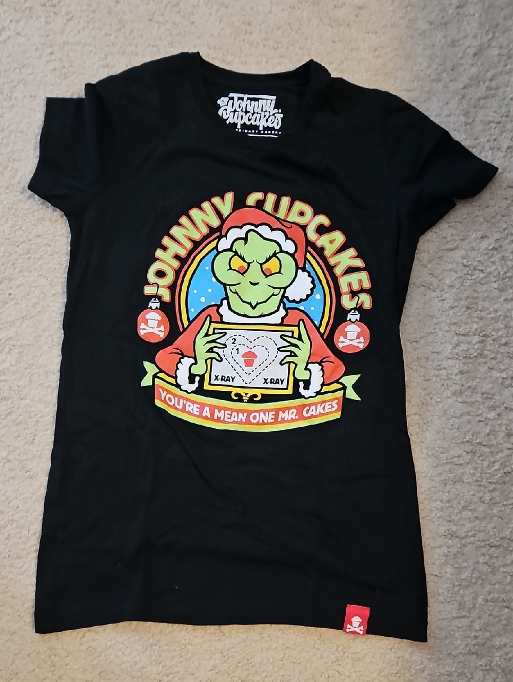 Johnny Cupcakes Black Tee with Green Grinch X-Ray Graphic and Red Accents